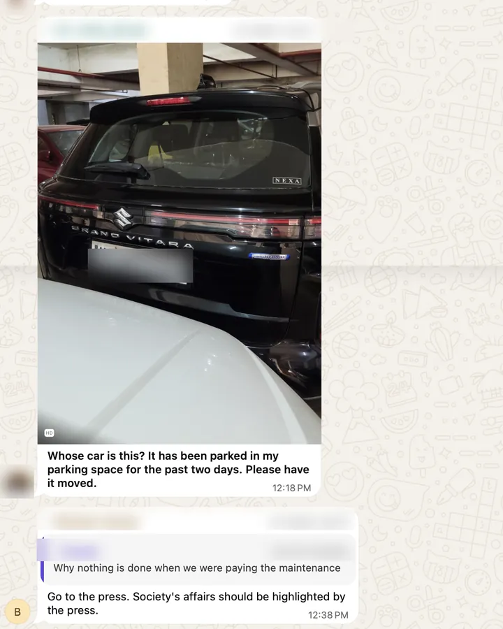 WhatsApp message with a photo of a black SUV parked in someone else's basement parking spot