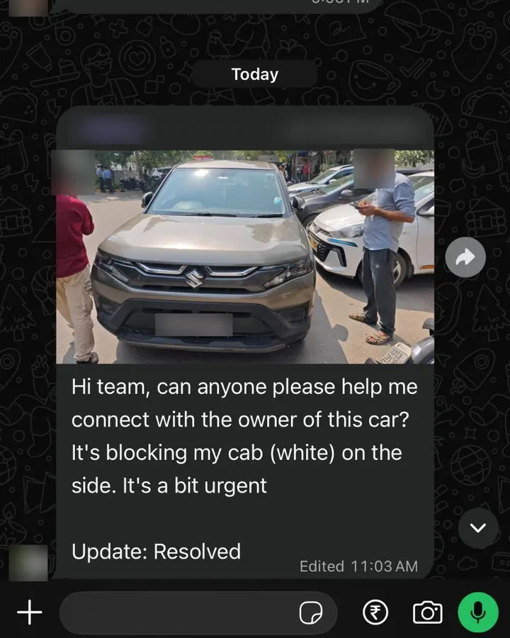 WhatsApp message with a photo of a car blocking a cab on a busy street